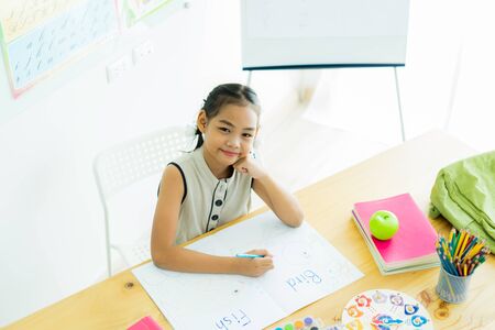 Asian cute little child girl drawing at homeの写真素材