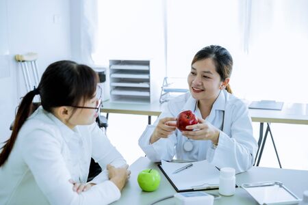 Female doctor consulting patient. Asian peopleの写真素材