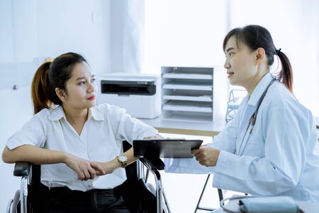Female doctor consulting patient. Asian peopleの写真素材