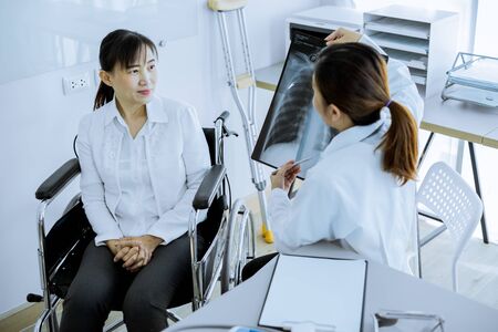 Female doctor consulting patient. Asian peopleの写真素材
