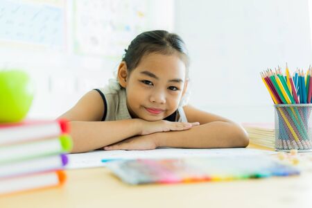 Asian cute little child girl drawing at homeの写真素材