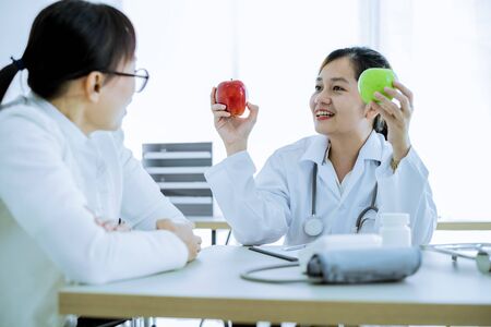 Female doctor consulting patient. Asian peopleの写真素材
