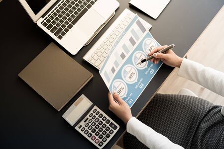 Business women reviewing data in financial statement. Accounting conceptの写真素材