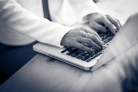 Asian business woman reviewing data in financial charts and graphs. Accountingの写真素材