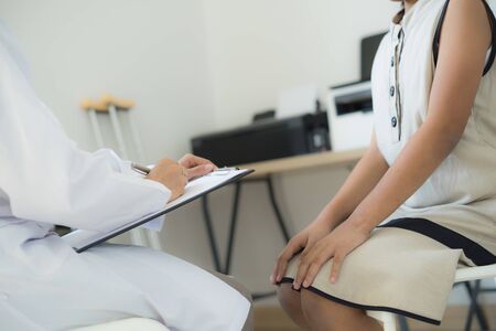 Asian cute girl visiting a doctorの写真素材