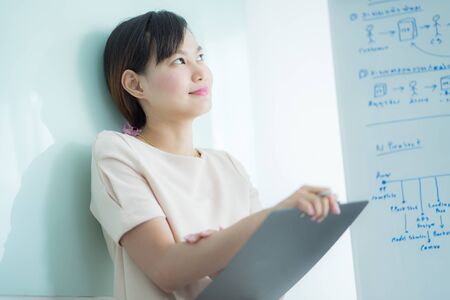 Portrait of young beautiful asian business woman in the office.の写真素材