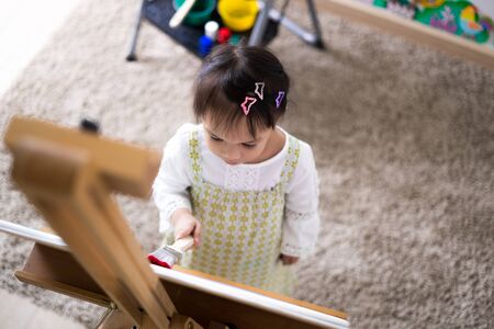 Asian cute little child girl drawing at home. Education conceptの写真素材