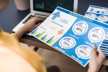 Business women reviewing data in financial charts and graphs. Accountingの写真素材