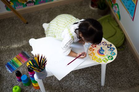 Asian cute little child girl drawing at home. Education conceptの写真素材