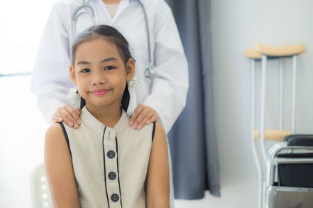 Asian cute girl visiting a doctorの写真素材
