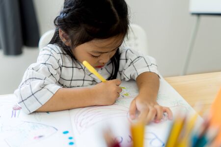 Asian cute little child girl drawing at home. Education conceptの写真素材