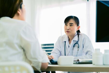 Female doctor consulting patient. Asian peopleの写真素材