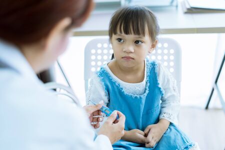 Asian cute girl visiting a doctorの写真素材