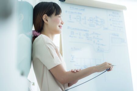 Portrait of young beautiful asian business woman in the office.の写真素材