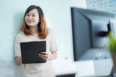 Portrait of young beautiful asian business woman in the office.の写真素材