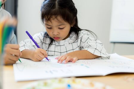 Asian cute little child girl drawing at home. Education conceptの写真素材