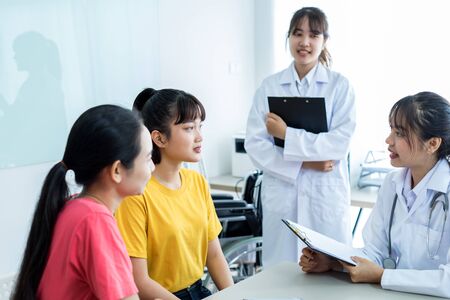 Female doctor consulting patient. Asian peopleの写真素材