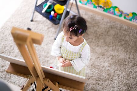 Asian cute little child girl drawing at home. Education conceptの写真素材