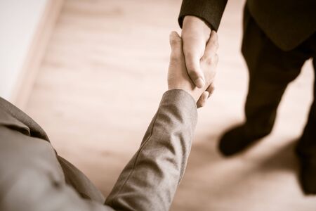 Businessman shaking hands to seal a deal with his partnerの写真素材