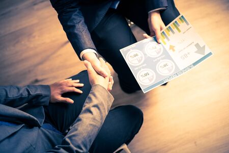 Businessman shaking hands to seal a deal with his partnerの写真素材