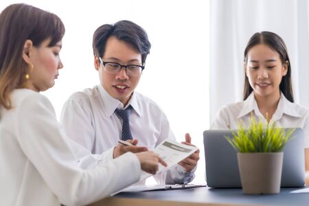 Group of business people busy discussing financial matter during meeting. Asian peopleの写真素材
