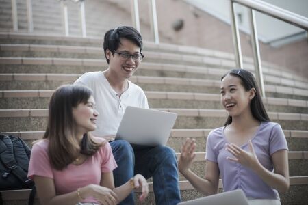Group of happy teen high school students outdoors. Asian peopleの写真素材