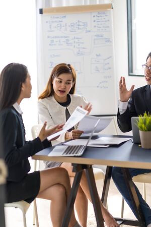 Group of business people busy discussing financial matter during meeting. Asian peopleの写真素材