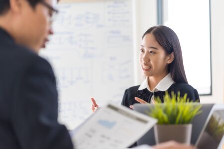 Group of business people busy discussing financial matter during meeting. Asian peopleの写真素材