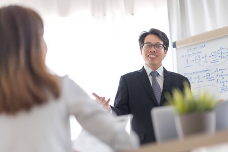 Group of business people busy discussing financial matter during meeting. Asian peopleの写真素材