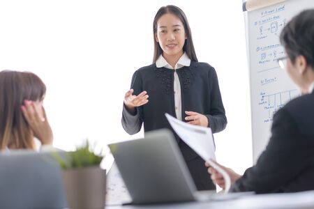 Group of business people busy discussing financial matter during meeting. Asian peopleの写真素材