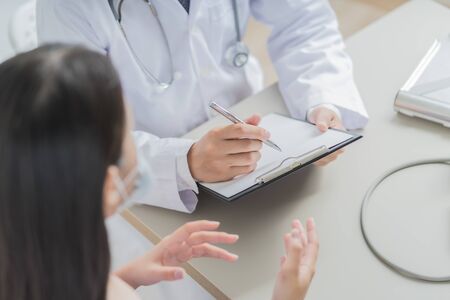 Doctors and patient talking about therapy. Asian peopleの写真素材