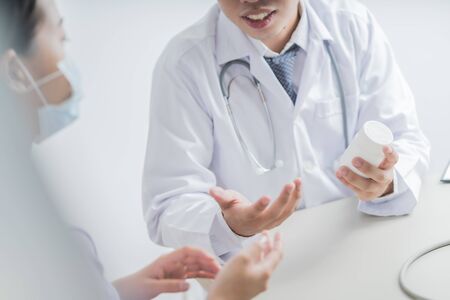 Doctors and patient talking about therapy. Asian peopleの写真素材