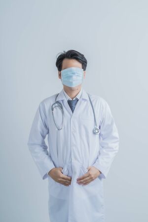 Doctor wearing protection face mask against coronavirus.Asian peopleの写真素材