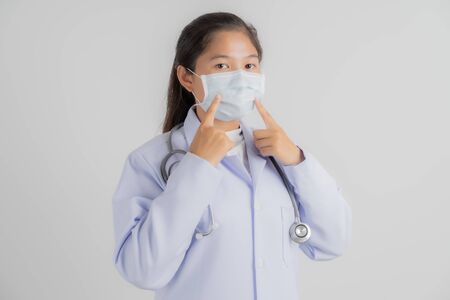 Doctor woman wearing protection face mask against coronavirus.Asian peopleの写真素材