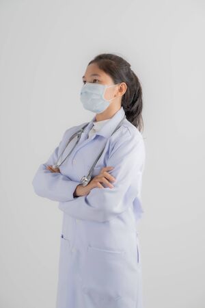 Doctor woman wearing protection face mask against coronavirus.Asian peopleの写真素材