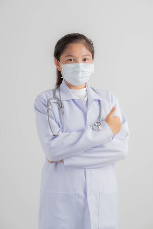 Doctor woman wearing protection face mask against coronavirus.Asian peopleの写真素材