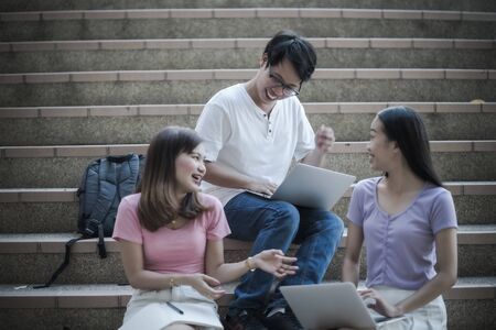 Group of happy teen high school students outdoors. Asian peopleの写真素材