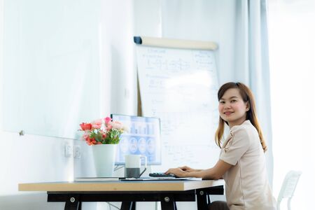 Young asia woman working at home or in a small office. Asian peopleの写真素材