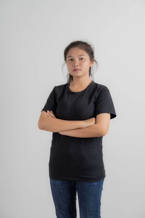 Do not miss. Young asian woman shouting. Shout. Crying emotional woman screaming on pink studio background. Female half-length portrait. Human emotions, facial expression concept. Trendy. Asian peopleの写真素材