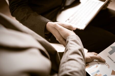 Businessman shaking hands to seal a deal with his partnerの写真素材