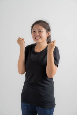Do not miss. Young asian woman shouting. Shout. Crying emotional woman screaming on pink studio background. Female half-length portrait. Human emotions, facial expression concept. Trendy. Asian peopleの写真素材