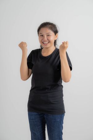Do not miss. Young asian woman shouting. Shout. Crying emotional woman screaming on pink studio background. Female half-length portrait. Human emotions, facial expression concept. Trendy. Asian peopleの写真素材