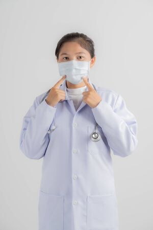 Doctor woman wearing protection face mask against coronavirus.Asian peopleの写真素材