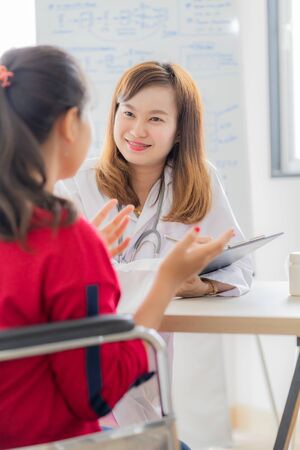Female doctor consulting patient. Asian peopleの写真素材