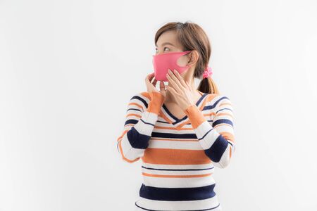 Close up portrait of young woman with medicine health care mask against white white background. CoronaVirus, Covid-19. Asian peopleの写真素材