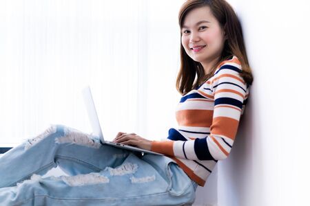 Asia student studying with laptop at home. Education Concept. Asian peopleの写真素材