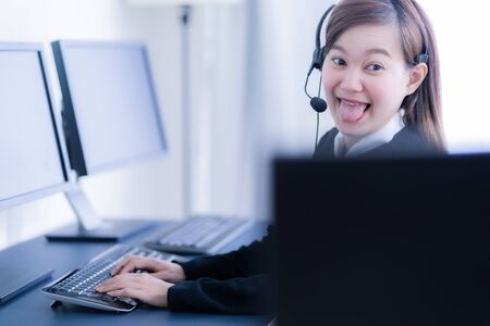 Asian young woman working in call centre