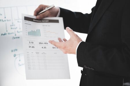 Businessman analyzing investment charts with laptop. Accounting conceptの写真素材