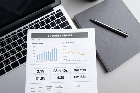 Laptop with  graph chart report screen on work table. Home office or work space. Strategy analysis financial accounting conceptの写真素材