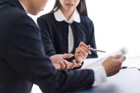 Group of business people busy discussing financial matter during meeting. Asian peopleの写真素材